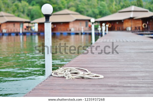 Light\
bulbs and rope and the bridge float on the\
water