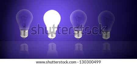 Light bulbs stand in rows one glows