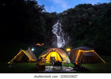 Light and campfire on night time at Mae tear waterfall near Doi inthanon in Chiang mai, Northen, Thailand