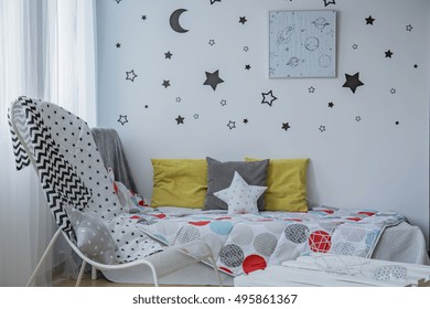 Light Child Bedroom With Window, Single Bed And Stars On The Wall