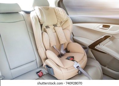 Light Children's Car Seat In A Bright Leather Interior