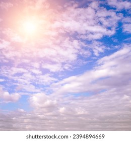 Light clouds and bright sun in the blue sky. - Shutterstock ID 2394894669