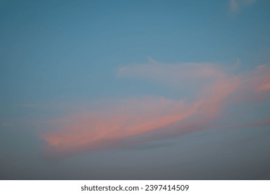 Light clouds in sky during sunset. Colourful clouds in the sky, evening photo