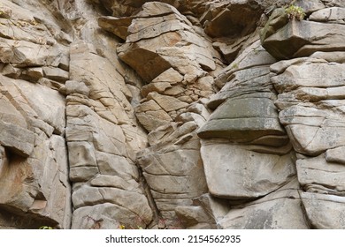 Light Coarse Natural Rock Stone Background. Mining Cliff Rough Front Surface. Big Limestone Stack Backdrop. Heavy Grunge Damaged Granite Block Texture. Crack Antique Medieval Stony Facade For Design