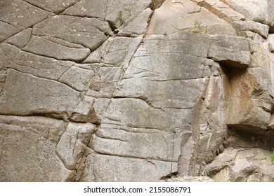 Light Coarse Natural Rock Stone Background. Mining Cliff Rough Front Surface. Big Limestone Stack Backdrop. Heavy Grunge Damaged Granite Block Texture. Crack Antique Medieval Stony Facade For Design