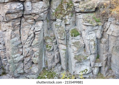 Light Coarse Natural Rock Stone Background. Mining Cliff Rough Front Surface. Big Limestone Stack Backdrop. Heavy Grunge Damaged Granite Block Texture. Crack Antique Medieval Stony Facade For Design