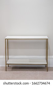 Light Colored White And Bright Empty Accent Side Table With A Marble Top And Gold Finishes With Nothing On It