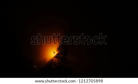 Similar – Image, Stock Photo Blood moon at total lunar eclipse, shining through trees