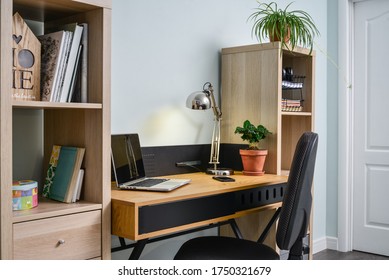 Light Cozy Teen Room With White Bookcases, Working Desk And Laptop On It
