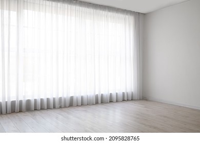 Light curtains on big window in empty room - Shutterstock ID 2095828765