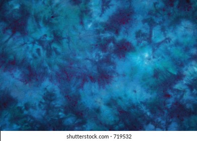 Light and dark blue tie dyed fabric