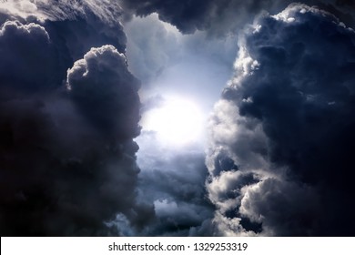 Light in the Dark and Dramatic Storm Clouds