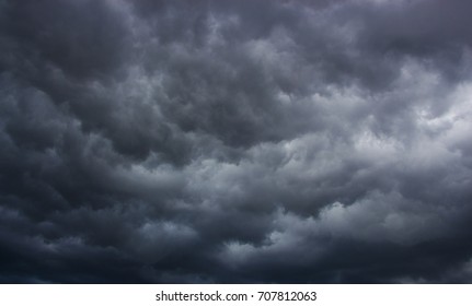 Light in the Dark and Dramatic Storm Clouds background - Shutterstock ID 707812063