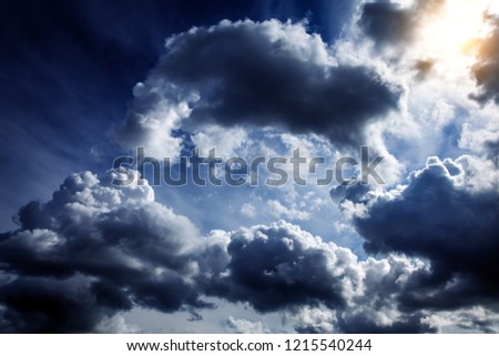 Light in the Dark and Dramatic Storm Clouds