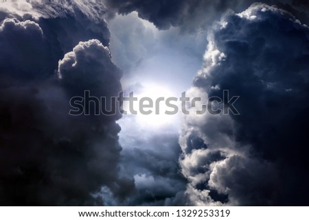 Light in the Dark and Dramatic Storm Clouds