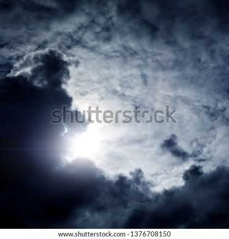 Light in the Dark and Dramatic Storm Clouds