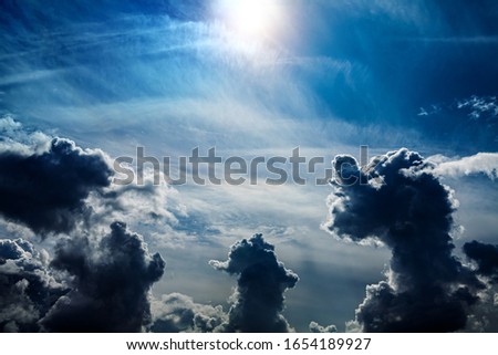 Light in the Dark and Dramatic Storm Clouds