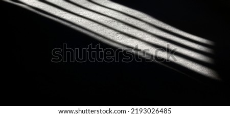 Light in the darkness in prison. Abstract reflection of light from a window with bars on the floor. Originаl photo - NotAI