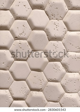 Light decorative panels replicating hexagonal tile look displayed in a hardware store aisle for contemporary interior design and wall finishing use