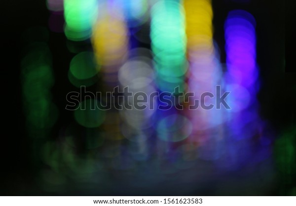 The light defocused seen through water in\
the nighttime saw many colors in cool tone. The light gradually\
reduce the contrast from top down to the\
bottom.