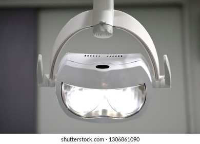 Light With Dental Chair White Color Blur Background