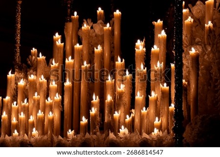 Light and devotion: candles burning in the darkness during the procession