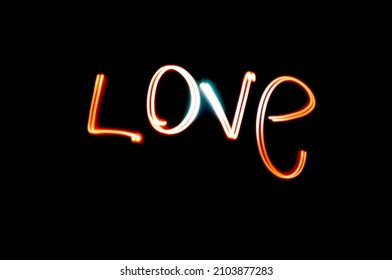 light doodle.Light and shadow graffiti "IOVE" word. Romantic love material. Ideal for Valentine's Day, love confessions, etc.Black background.