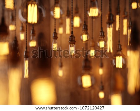 The light from the Edison lamp. Hang on the background of a wooden wall, depth-of-field camera effects. 3D rendering