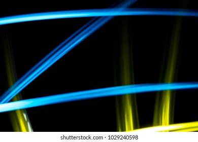 Light effect background. Multicolored luminous tracks in the dark.