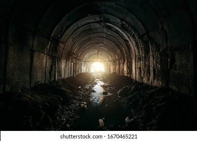 Light at the end of dirty sewer tunnel