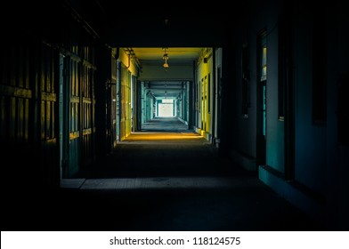 Light At The End Of The Hallway In Dark Colors