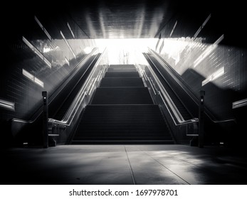 Light at the end of tunnel.  Staircase going up to the light
