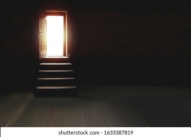 Light Entering Through Open Door To A Dark Room