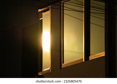 Light In Evening Time Shine To The Window Reflex On Glass Window