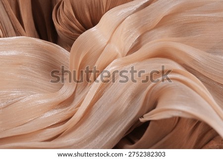Light fabric waves in soft tones on a neutral background