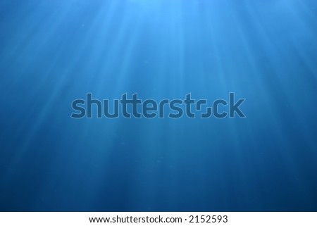 Light falling in clear blue water