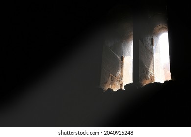 light falling through a window in an old church