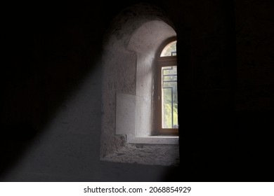 light falling through a window in an old church