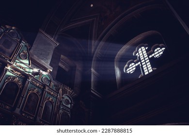 light falling through window in old church on foto