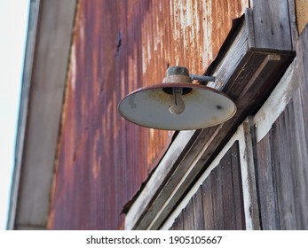 Light fixture on an old rusty building  - Powered by Shutterstock