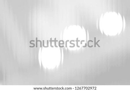 Light gray background with circles and ovals of different sizes. Template for a greeting card for the New Year. Artistic abstract bokeh circles.  A game of light.