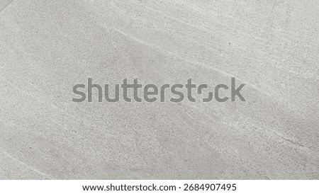 Light gray concrete or stone surface background texture with subtle diagonal brush or grain lines. Minimalist abstract backdrop suitable for construction, design, or modern themes.