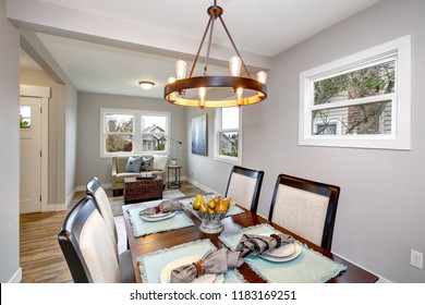 Light gray interior of transitional dining room and living room. - Powered by Shutterstock - Get 15% off with code: PIKWIZARD15