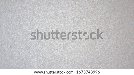 A light gray rough surface is bad from brushed silver metal. Background.
