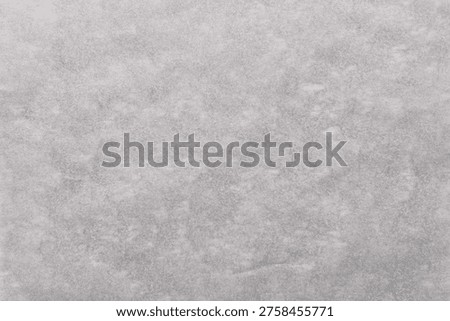 Light gray textured background with a subtle, mottled pattern resembling concrete or stone, offering a neutral and versatile backdrop.