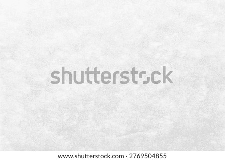 Light gray textured background with a subtle, cloudy pattern, resembling soft marble or concrete.