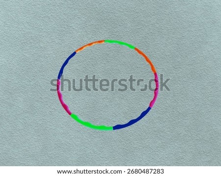 The light green background in the image is a circular hula hoop Colorful circles are used to rotate around the waist for indoor exercise for good health and to maintain a good figure.
