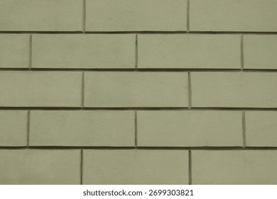 Light green plastered wall with rectangular pattern