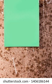 Light green rectangular empty blank on a old stone wall.
