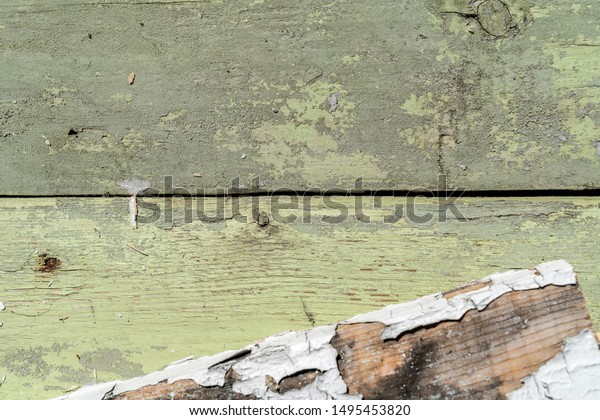 Light green and white wooden texture background.\
Old wood boards. Different scratches and lines. Grungy surface.\
Lines divide the picture into two parts. Background for text or\
design